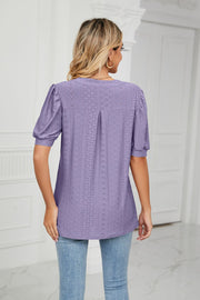 Purple perforated puff sleeve blouse with eyelet detail and back pleat.