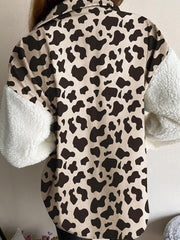 Plaid & Sherpa Hybrid Shacket with cow print body and sherpa sleeves.
