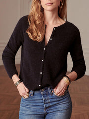 Black cashmere cardigan with plunging neckline and pearl buttons