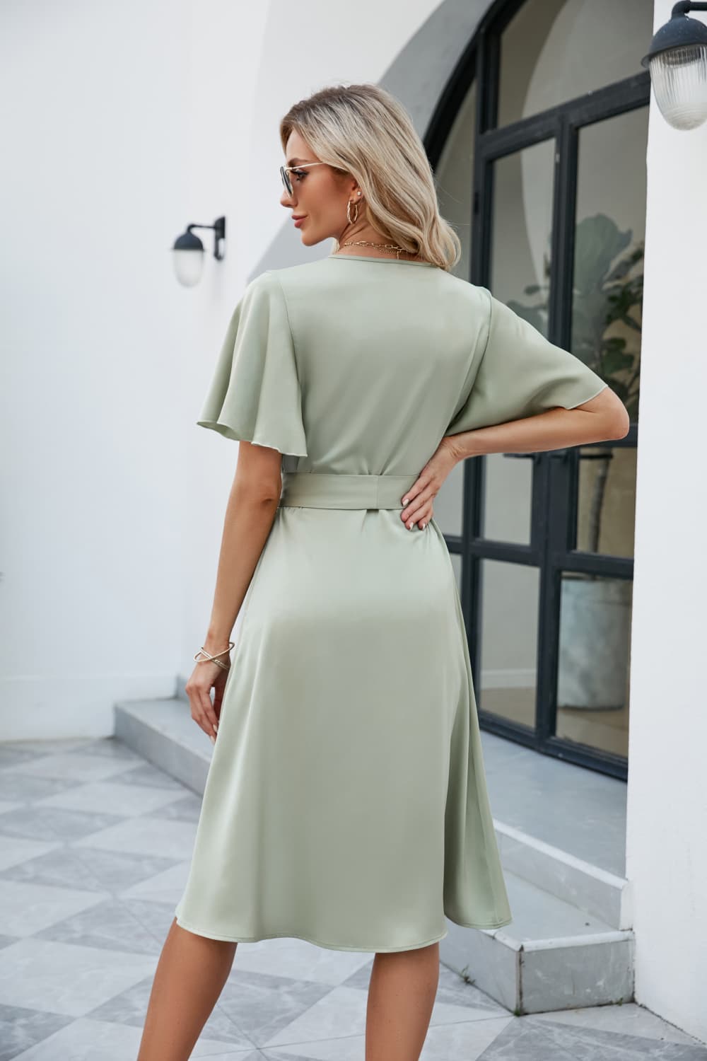 Light Green silk wrap midi dress with butterfly sleeves and adjustable tie waist.