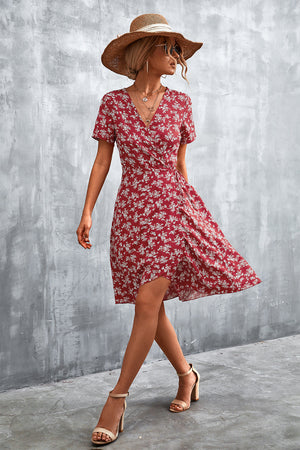 Crimson floral wrap midi dress with short sleeves and a v-neckline.
