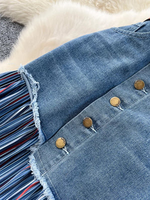 Patchwork denim midi skirt with striped detail and button front.