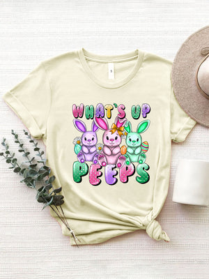 Cream Easter Bunny graphic tee with "What's Up Peeps" text and three colorful bunnies.