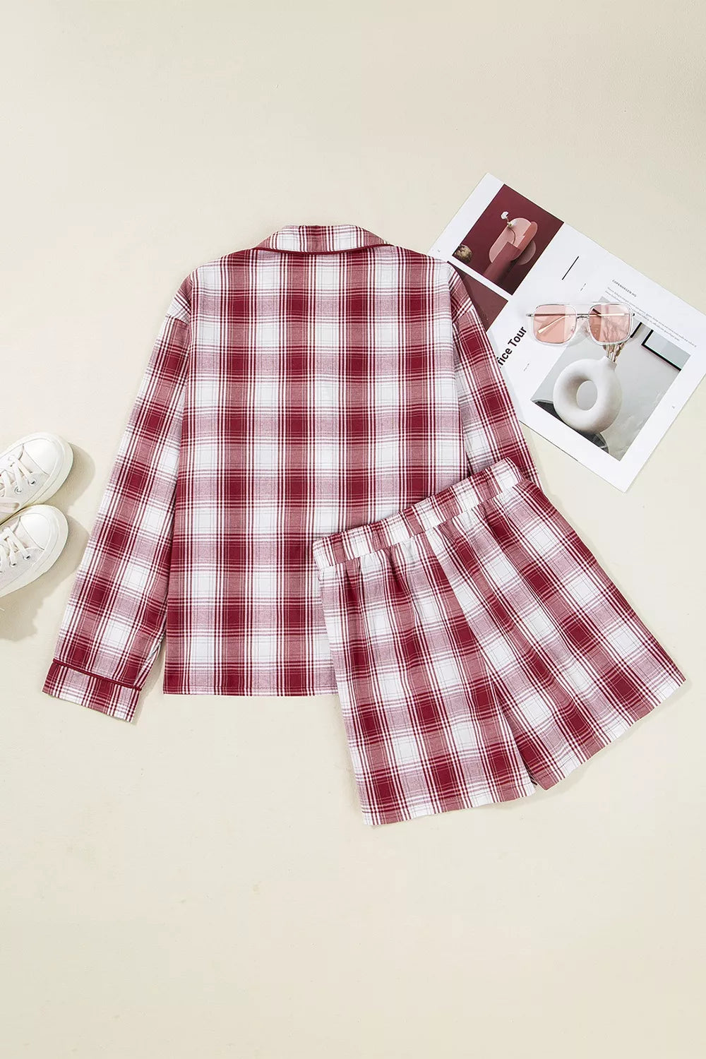 Cozy red plaid cotton pajama set with buttoned long sleeve top and elastic waist shorts.