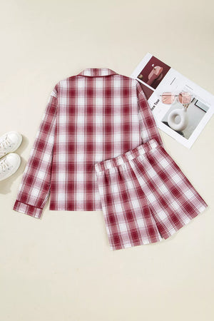 Cozy red plaid cotton pajama set with buttoned long sleeve top and elastic waist shorts.