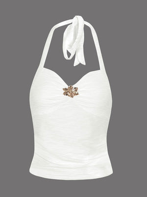White ruched halter neck cami with floral embellishment and tie back.