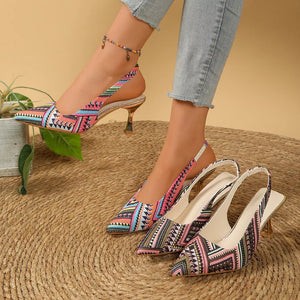 Geometric patterned slingback kitten heels in multicolor and red with pointed toes and a gold heel.