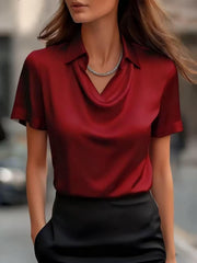 Wine red satin cowl neck maternity shirt with short sleeves.