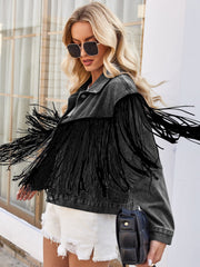 Black denim trucker jacket with dramatic fringe trim and a relaxed fit.
