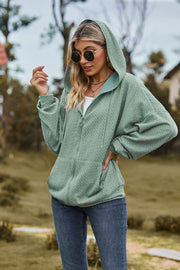 Sage textured cable knit zip-up hoodie with pockets and drawstring hood.