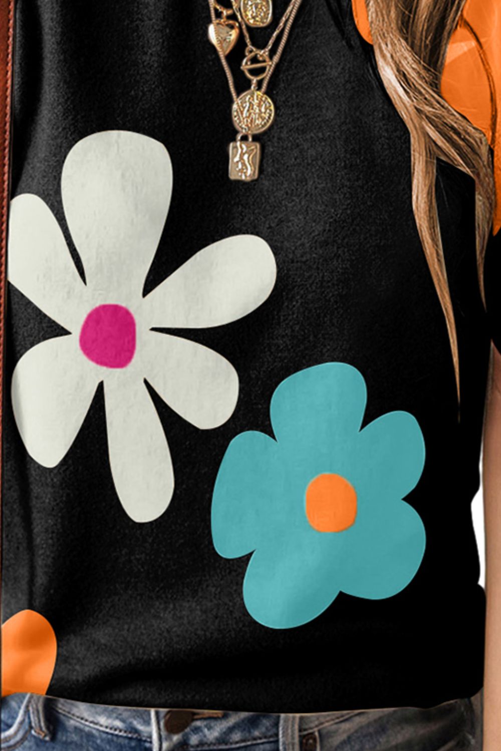 Black puff sleeve top with large white and aqua floral print