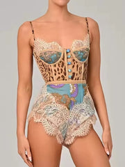 Leopard lace-trimmed romper with button details and ornate print shorts.