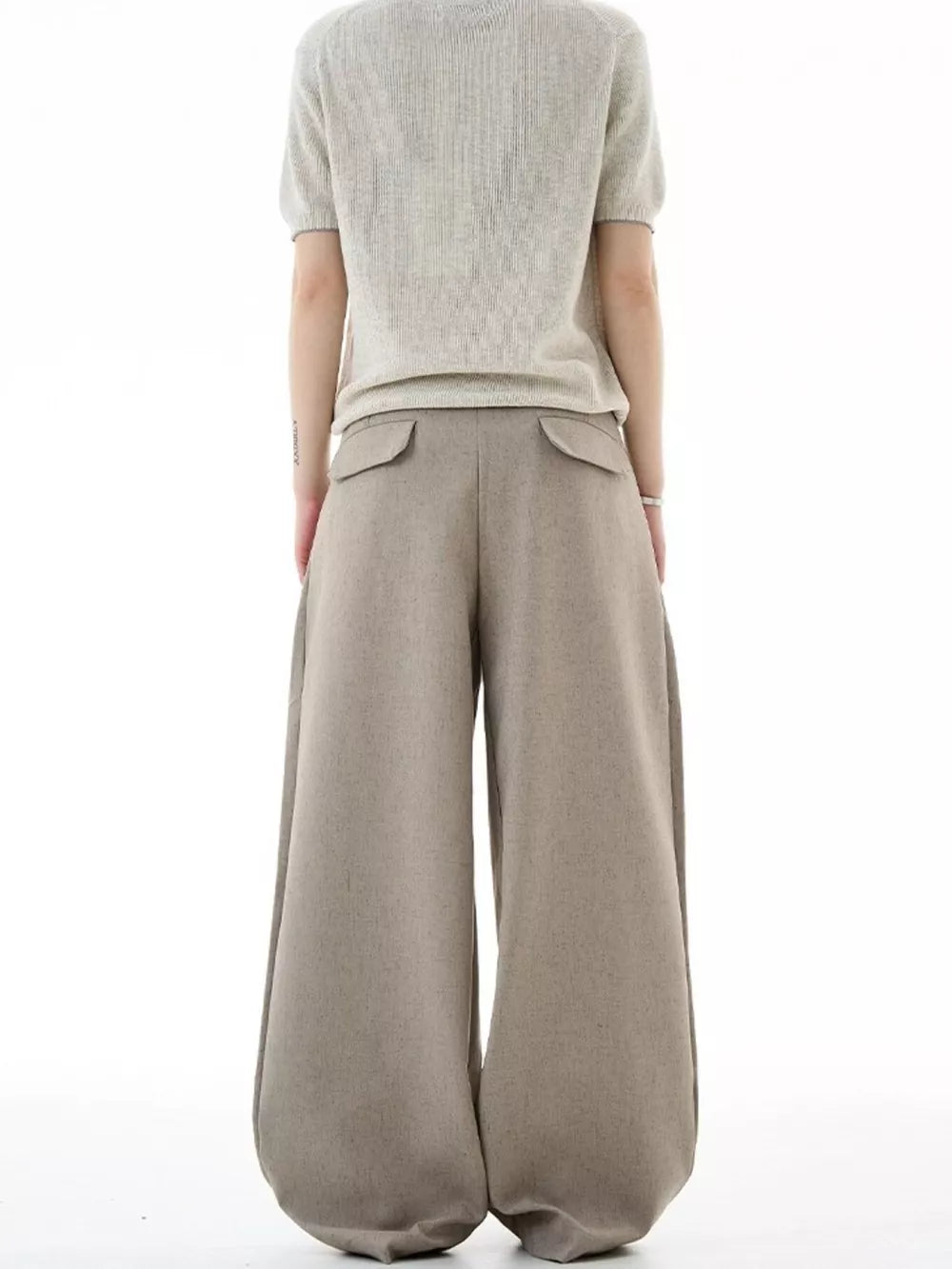 Tailored plus size wide-leg sweatpants in khaki with two back pockets.