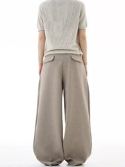Tailored plus size wide-leg sweatpants in khaki with two back pockets.