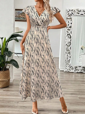 Apricot floral print midi dress with cap sleeves and a-line cut.