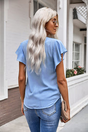 Pastel blue ruffle sleeve tie-front blouse with V-neck