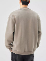 Men's oversized khaki graphic sweatshirt with crewneck and long sleeves.