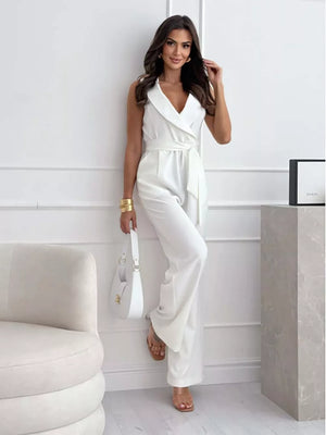 White wrap-front wide-leg romper with belted waist and V-neckline