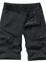 Black men's cargo shorts with elastic waistband, drawstring, zip fly, and zippered cargo pockets.