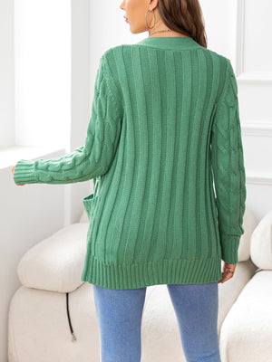 Textured cable-knit pocket cardigan in Gum Leaf green with ribbed detailing and cable sleeves.