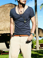 Men's dark blue relaxed scoop neck cotton tee with rolled sleeves.