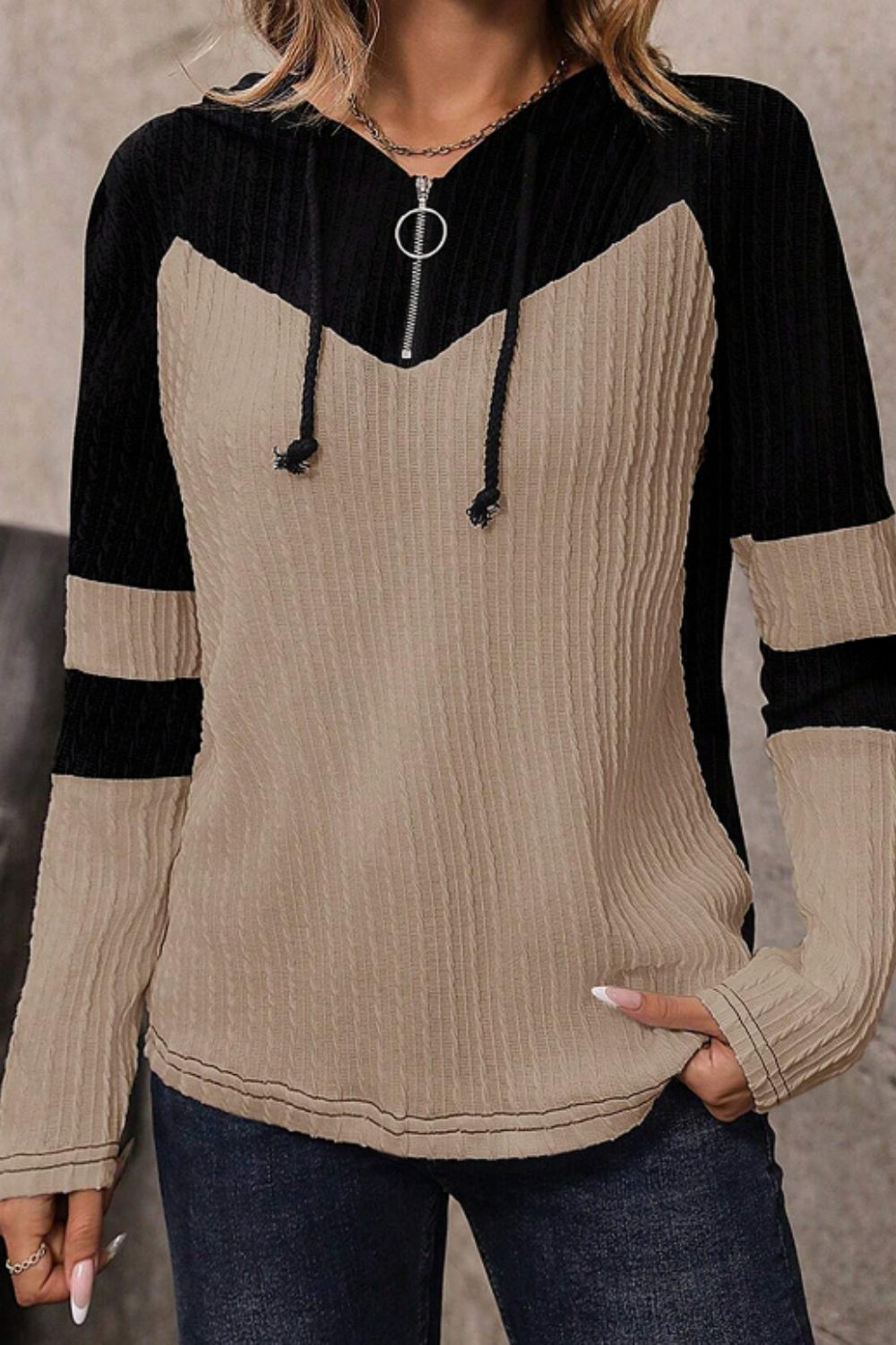 Colorblock ribbed zip-neck hoodie in mocha and black with a chevron pattern and contrast sleeve stripes.
