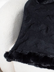 Black cable knit poncho with faux fur trim detail