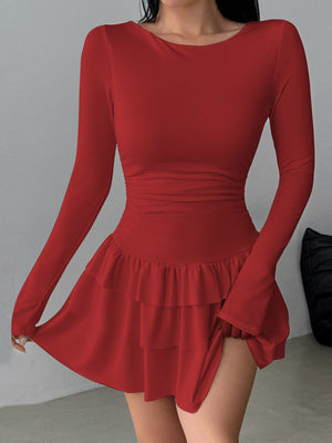 Red long sleeve mini dress with tiered ruffle hem and ruched waist detail.
