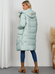 Sage quilted puffer parka with hood and buckle detail, long length.