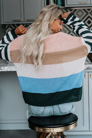 Colorblock boatneck sweater with horizontal stripes in pink, tan, white, blue, and green.