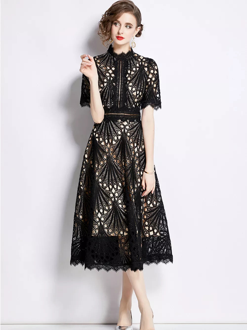 Elegant black lace midi dress with delicate sleeves and a-line skirt.