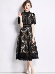 Elegant black lace midi dress with delicate sleeves and a-line skirt.