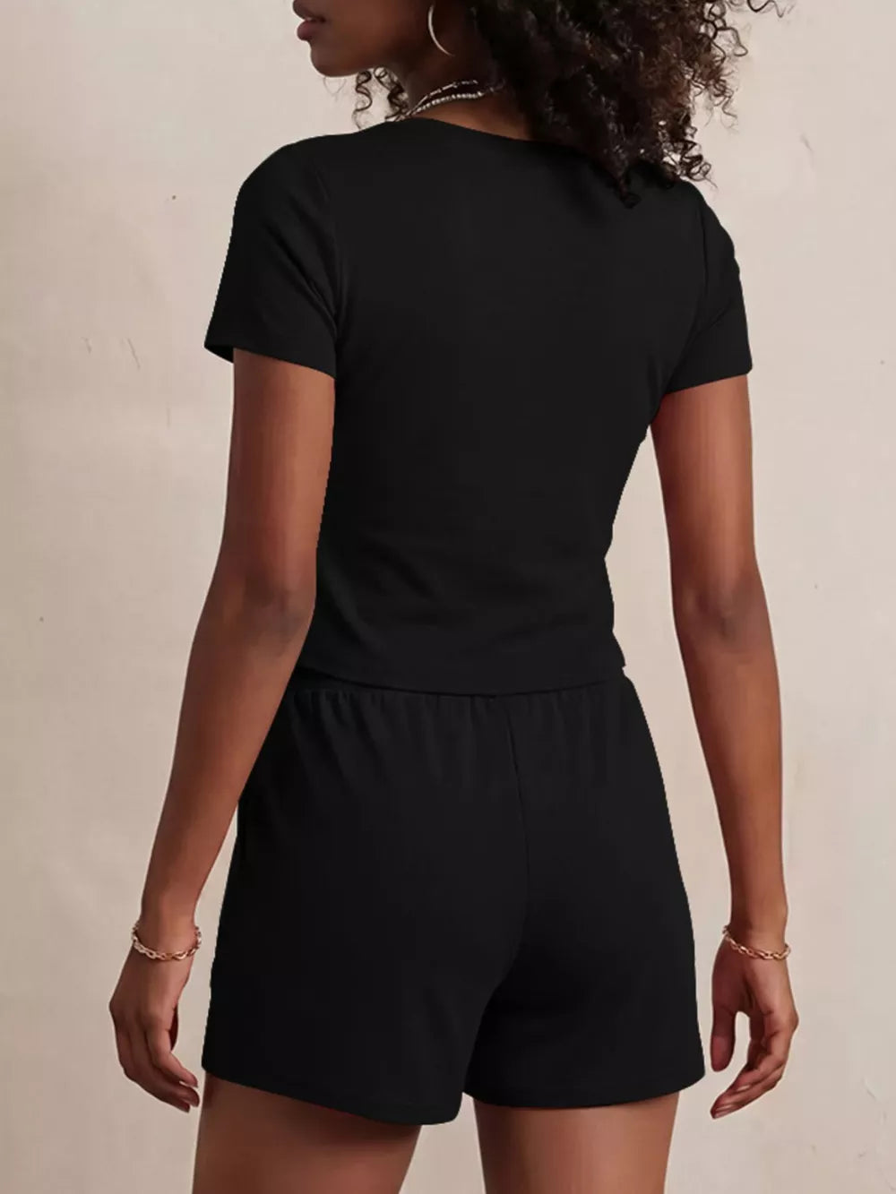 Black scoop-neck tee and drawstring shorts set for women, comfortable loungewear.