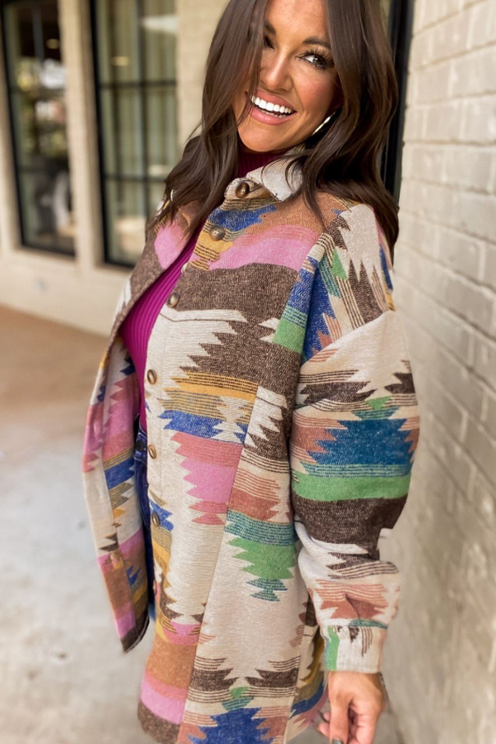 Southwestern print shirt jacket in beige with button front and colorful geometric patterns.