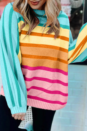 Ombre stripe knit sweater with ribbed cuffs in sherbet and turquoise colors.