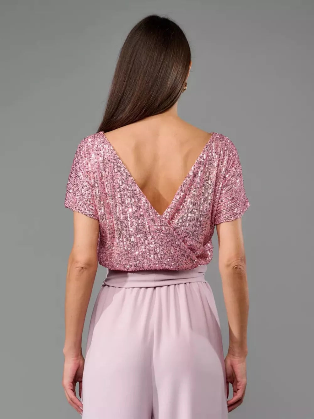 Pink sequin wrap top with wide-leg pants