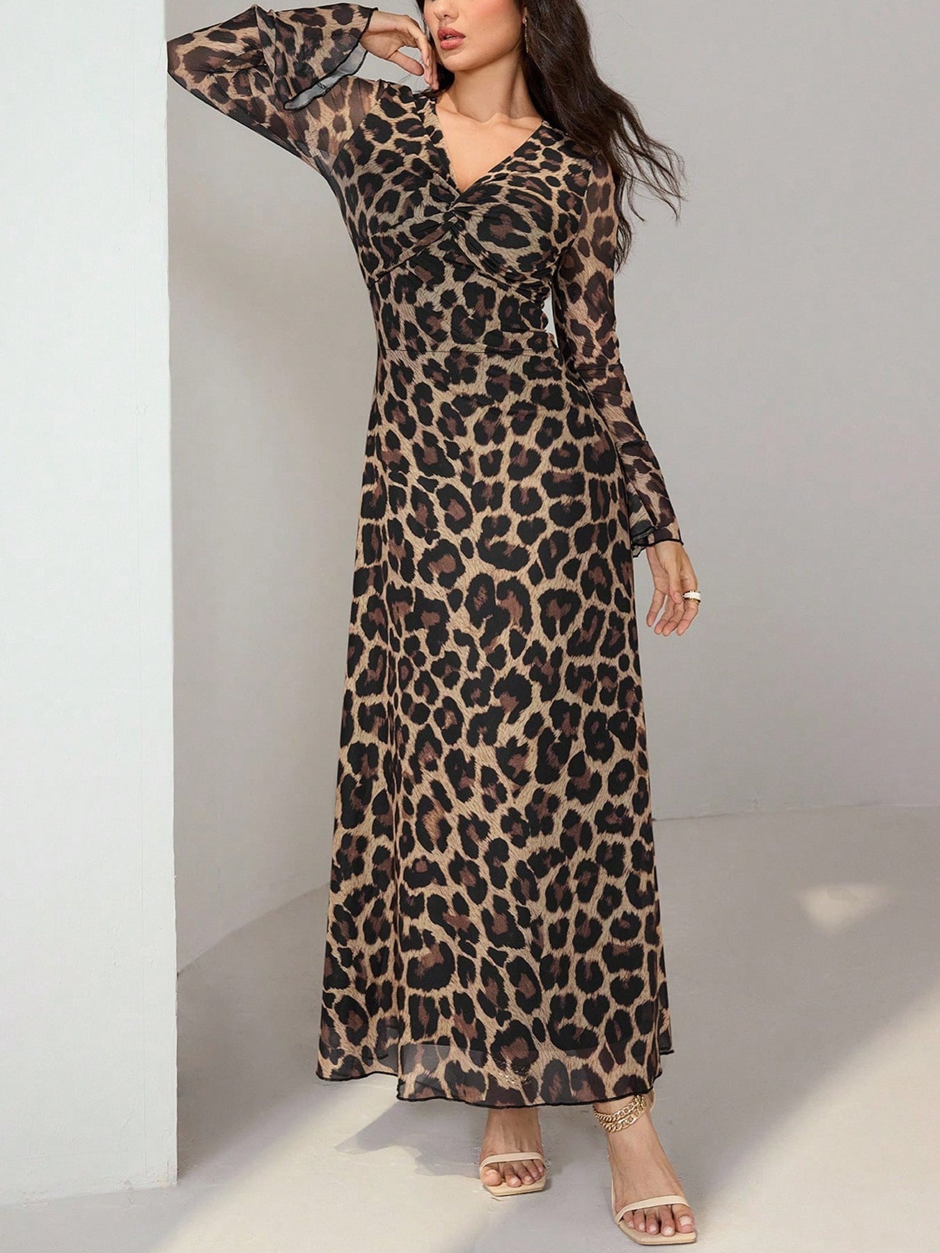 Maxi dress with animal print, flare sleeves, and a twisted V-neck in 100% polyester.
