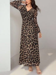 Maxi dress with animal print, flare sleeves, and a twisted V-neck in 100% polyester.