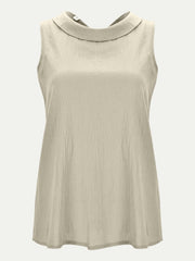 Sleeveless Peter Pan collar blouse in Eggshell with textured fabric.