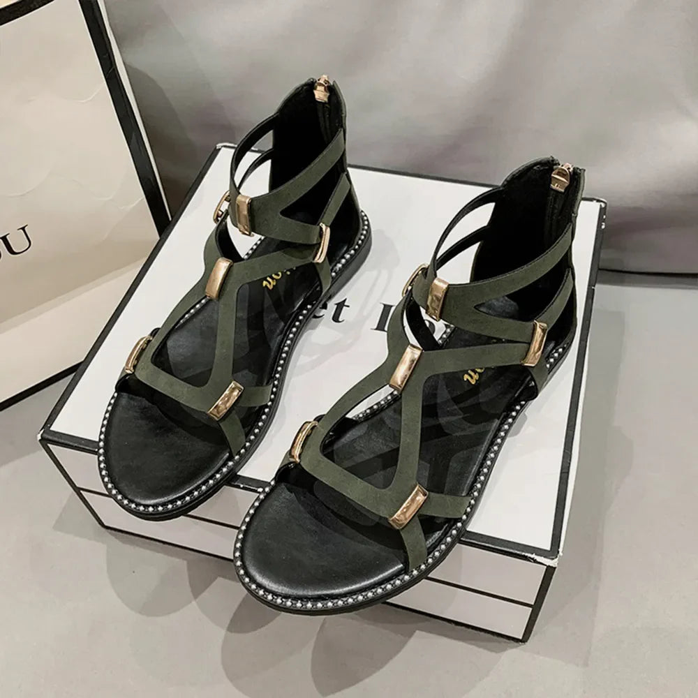 Army green gladiator sandals with gold accents and zip-back closure.