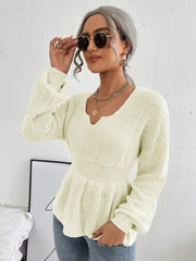 Ivory peplum knit sweater with scallop neckline and long sleeves