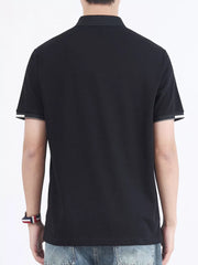 Black cotton polo shirt with contrasting sleeve cuffs and collar detail.