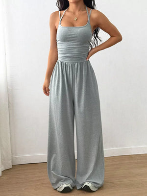 Light Gray ruched wide-leg jumpsuit with spaghetti straps and a square neckline.