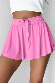 Fuchsia pink ruffled skort with elastic waistband and tie detail