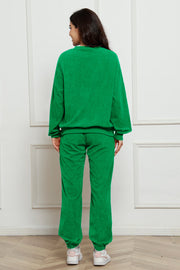 Green corduroy lounge set with crewneck sweatshirt and cuffed pants