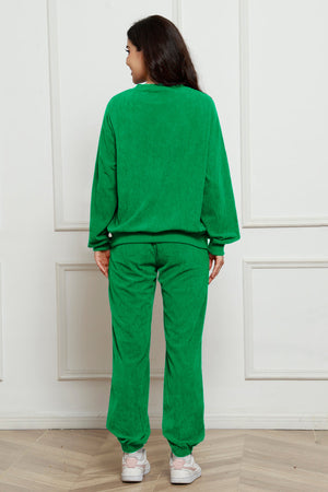 Green corduroy lounge set with crewneck sweatshirt and cuffed pants