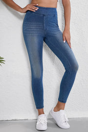 Denim-effect high-rise leggings in medium wash, featuring a sculpted fit and faux front pockets.