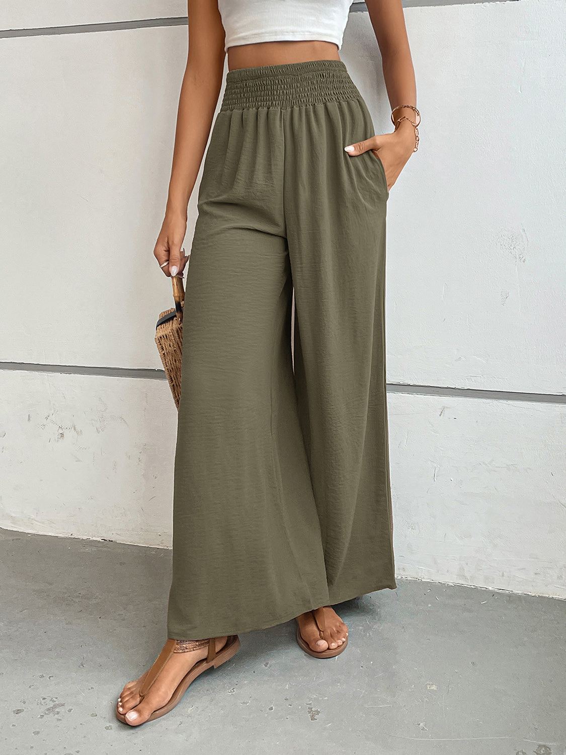 Moss green textured palazzo lounge trousers with smocked waist and pockets.