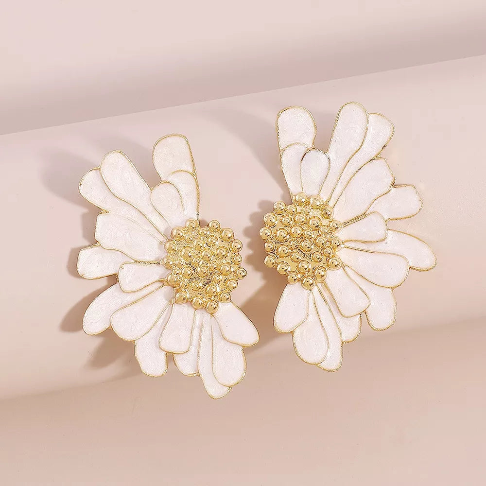Textured white flower stud earrings with gold centers.