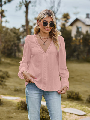 Blush pink textured blouse with lace trim neckline and cuffs